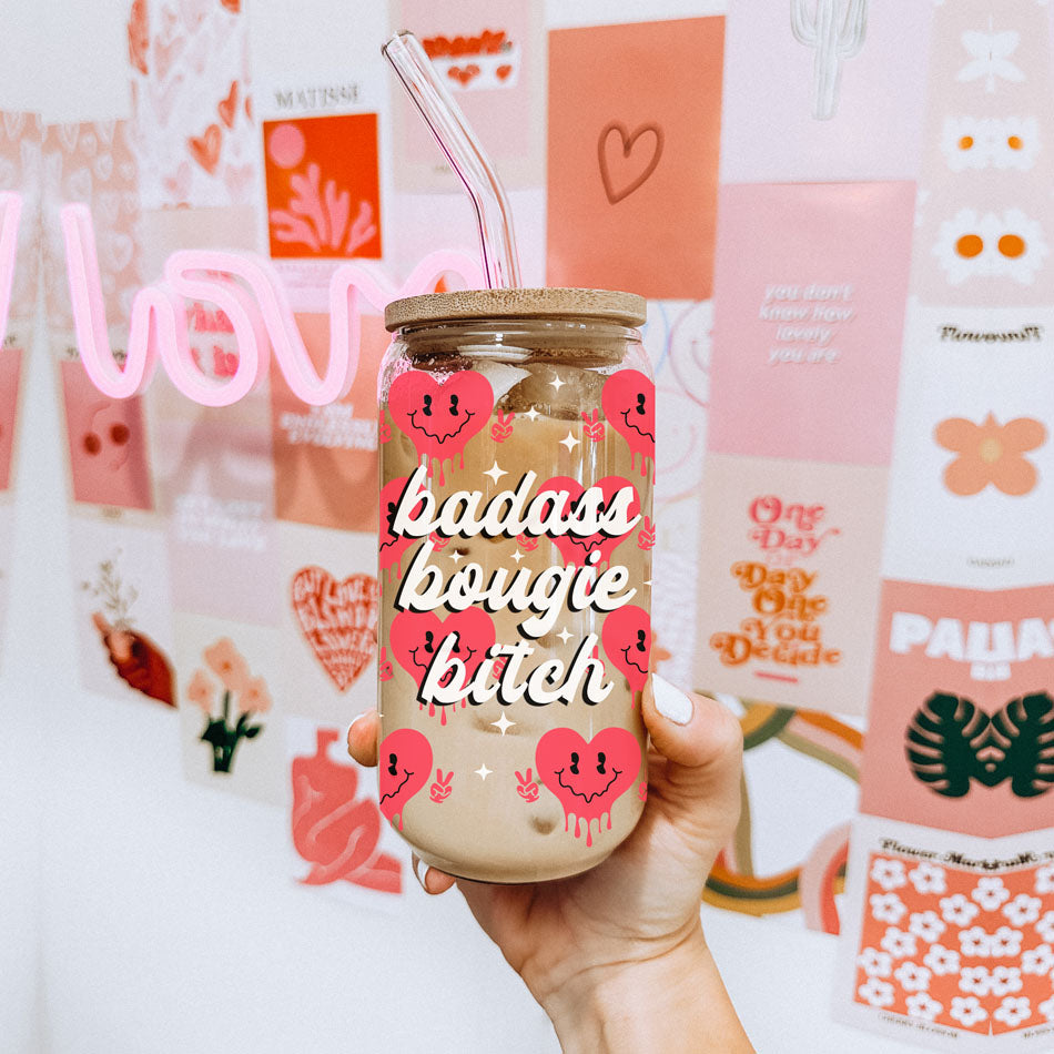 Badass bougie bitch glass cup 20oz with red retro smiley face hearts holding a peace sign up. Boss woman valentines day gift ideas. 20oz Vday glass cups with bamboo lid and glass straws.