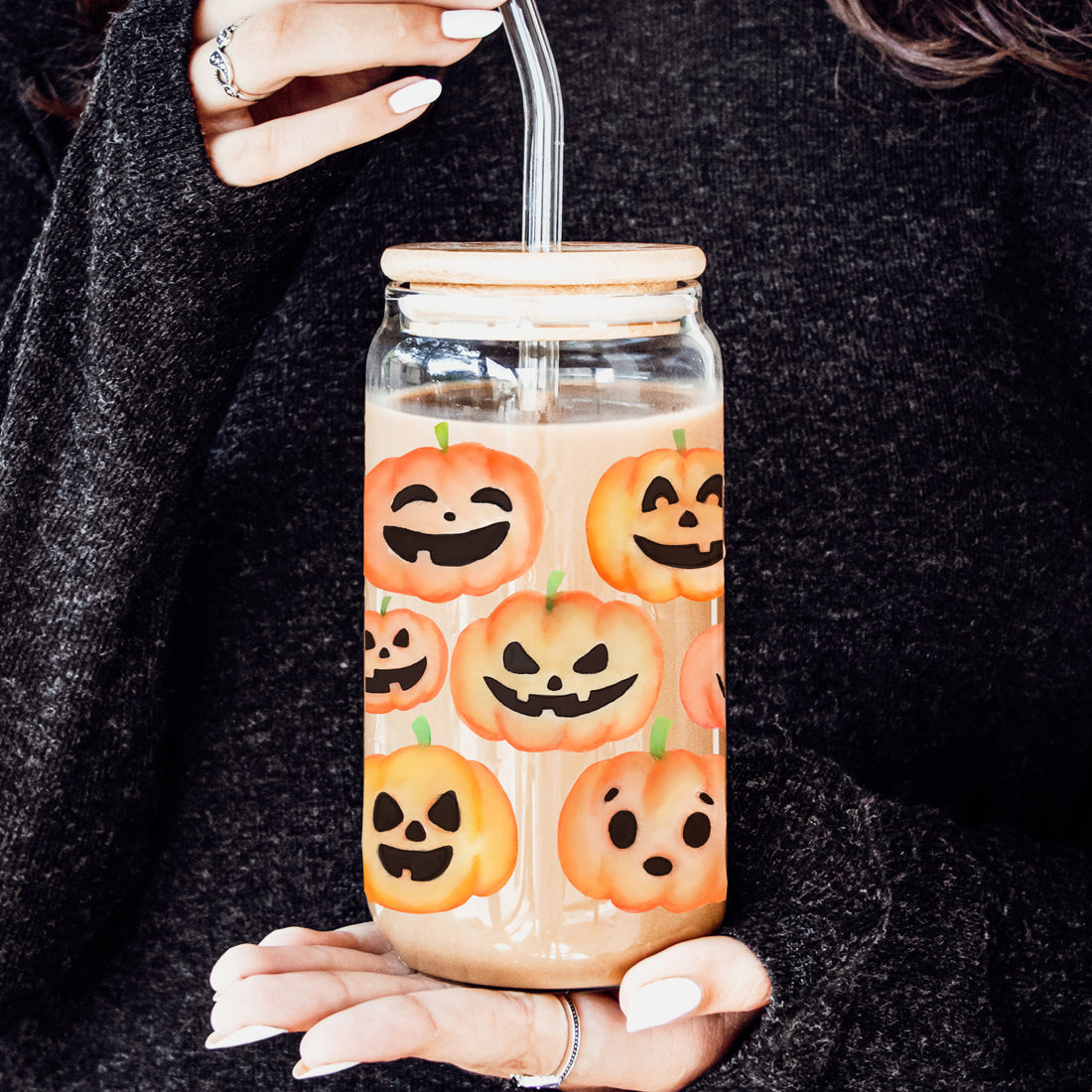 Watercolor pumpkin face glass tumbler with bamboo lid and straw
Halloween themed glass drinking cup with jack o lantern designs