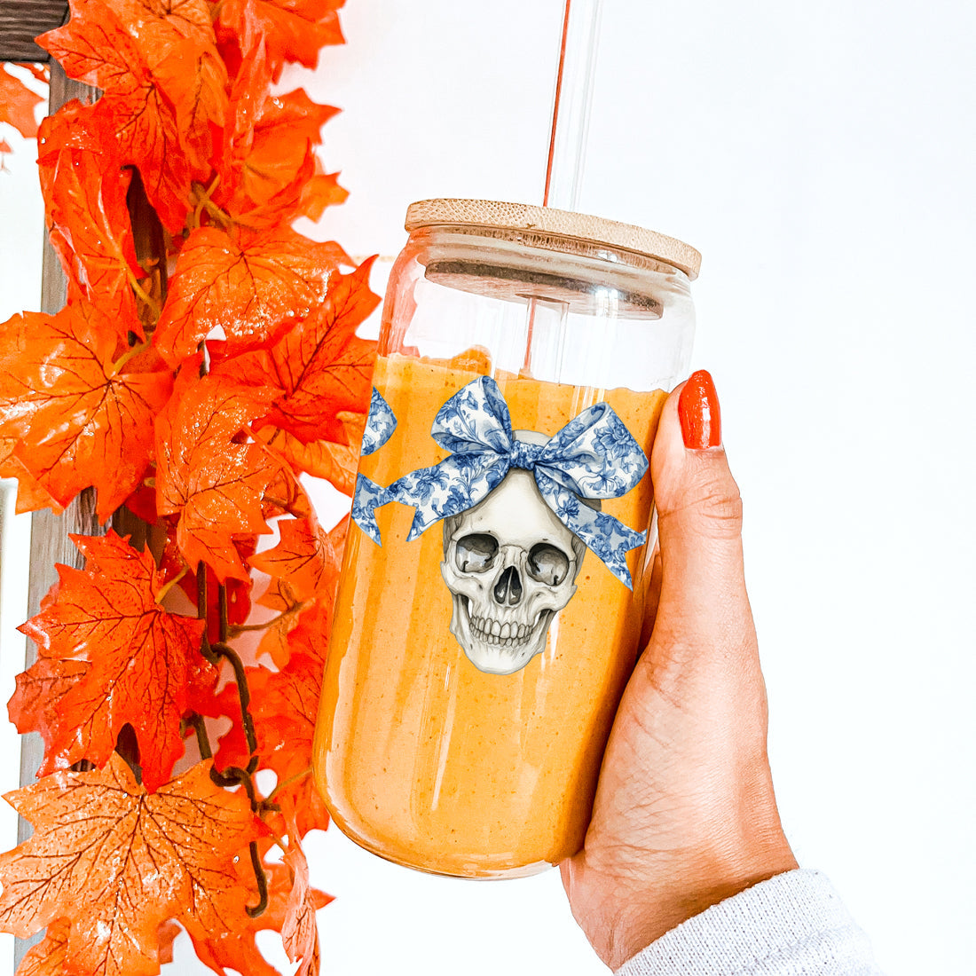 blue bow skull drinking glass
elegant halloween tumbler set
sophisticated spooky season glass
designer halloween drinkware